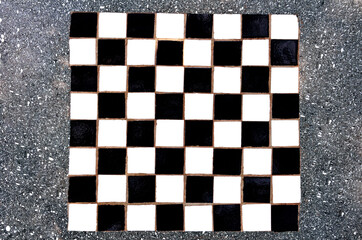 Obraz premium tile chessboard on concrete table