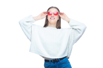 Studio portrait of pretty glamorous woman in the red sunglasses standing with her hands raised isolated on white background