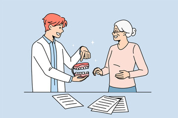 Male doctor consult old woman patient about teeth prosthesis in dental clinic. Man dentist show tooth model to senior female client. Dentistry and healthcare. Oral care. Flat vector illustration. 