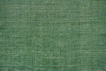 Fototapeta premium Green natural linen fabric, background or texture