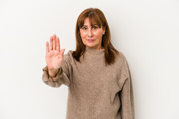 Middle age caucasian woman isolated on white background standing with outstretched hand showing stop sign, preventing you. - obrazy, fototapety, plakaty