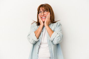 Middle age caucasian woman isolated on white background scared and afraid.