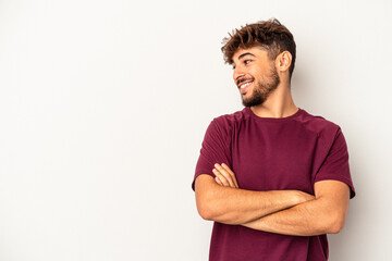 Fototapeta premium Young mixed race man isolated on grey background smiling confident with crossed arms.