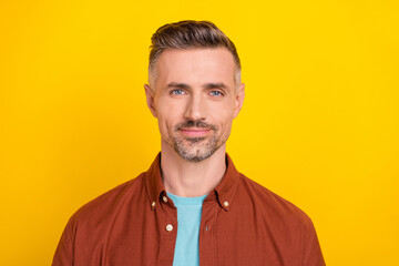 Portrait of professional aged guy marketer look good isolated over bright shine yellow color background