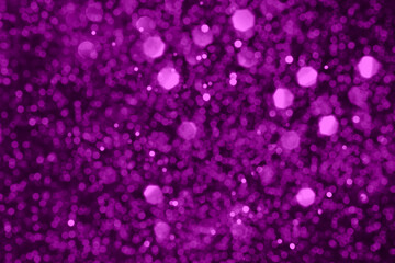 Velvet violet sparkling glitter background, christmas abstract shiny texture. Holiday lights