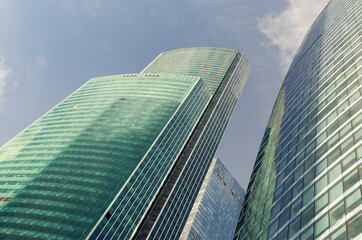Fototapeta na wymiar RUSSIA, MOSCOW: Bottom up scenic cityscape view of industrial glass skyscrapers 