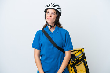 Young delivery woman with thermal backpack isolated on white background and looking up