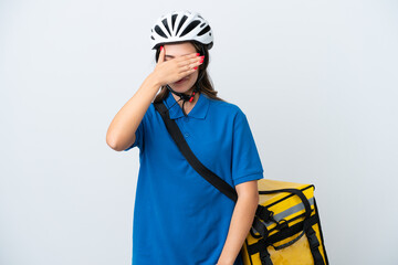 Young delivery woman with thermal backpack isolated on white background covering eyes by hands. Do not want to see something