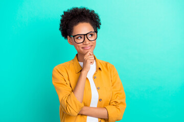 Photo of young black girl hand touch chin dreamy curious thoughtful look empty space isolated over...