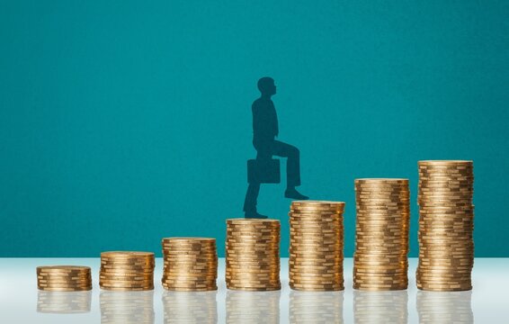 Economic growth stimulus. Concept with coins, person rising on coins