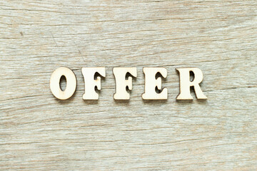 Alphabet letter in word offer on wood background