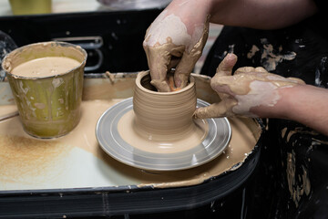 Clay modeling training on a potters wheel, clay master class. Art, creativity. Modeling clay, cultural traditions, hobby