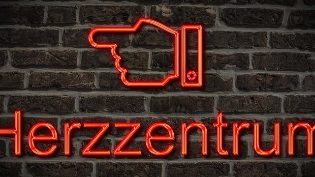 Detailansicht einer Leuchtreklame an einer Mauer mit der Aufschrift Herzzentrum