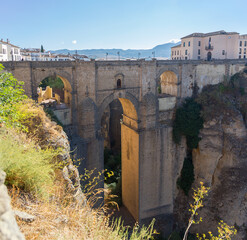 View at the New Bridge above the gauge and the natural geological phenomenon, erosion cliffs around the city, a iconic and touristic travel destination on Ronda city