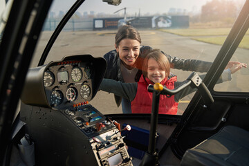 Excited lady and her kid dreaming about flying © Viacheslav Yakobchuk