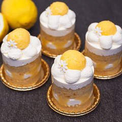 Lemon layer cake with lemon curd and fresh cream decorated like daisy flower