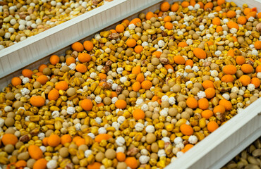 Various types of nuts in the assortment in bulk in bulk in the store