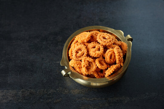 Rice murukku savoury Arisi murukku chakli chakali Pongal festival snack deep fried coconut oil traditional South Indian chennai Tamil Nadu India Kerala Sri Lanka, Onam, Vishu, Diwali Makar Sankranti