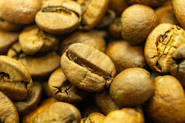 Texture of coffee beans. Brown gold. Macro photography