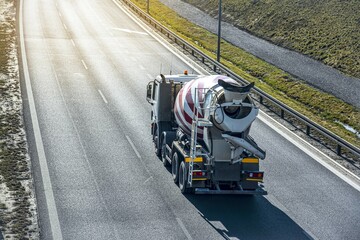 truck concrete mixer on the road - obrazy, fototapety, plakaty