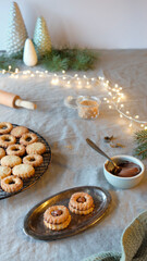 Sandwich cookies filled with hazelnut spread, nougat cream. Christmas Linzer cookies filled on...