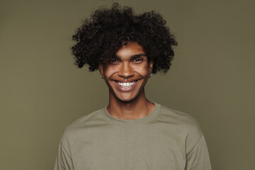 Young black man with piercing smiling and looking at camera