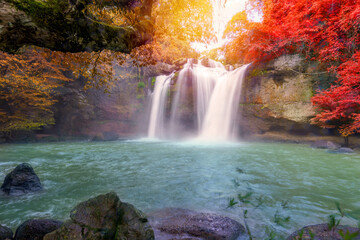 Fototapeta na wymiar Beautiful waterfall with sunlight in jungle, Haew Suwat Waterfall at khao yai Nakhonratchasima province