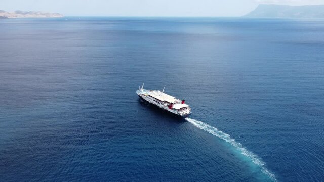 Passenger ship departing from port with destination Greek Islands.