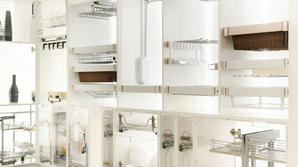 Kitchen cabinet organization ideas. Furniture fittings and components for organizing a kitchen cabinet. Exhibition stand with options for kitchen filling in a furniture store. Shelves and drawers.