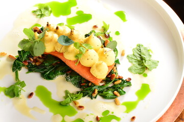 Fine dining Salmon steak with potato and spinach
