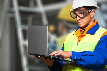 building contractor man Check and write down the details of the construction.