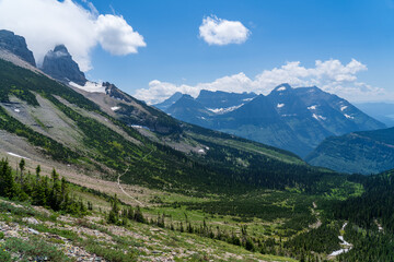Fototapeta na wymiar View of the Garden Wall, Grinnell Glacier Overlook, and the Continental Divide while hiking the Highline Trail in Glacier National Park in Montana on a sunny summer day
