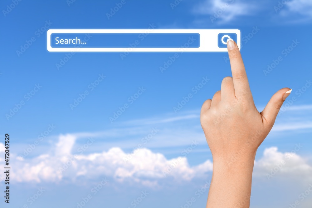 Wall mural A man standing with hands pointing to information search, clicking to virtual internet search page