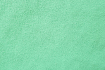 Plakat Felt pastel green soft rough textile material background texture close up,poker table,tennis ball,table cloth. Empty green fabric background...