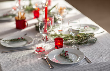 winter holidays, dinner party and celebration concept - close up of christmas table serving at home