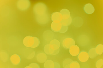 Abstract background blurred circles bokeh white on yellow background. Christmas and holiday symbol.