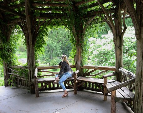 Woman Sitting in Green Central Park NYC Wooden Gazebo 