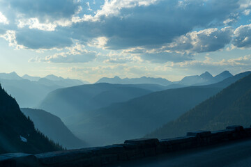 Golden hour, as viewed while driving on the Going to the Sun Road in Glacier National Park in...