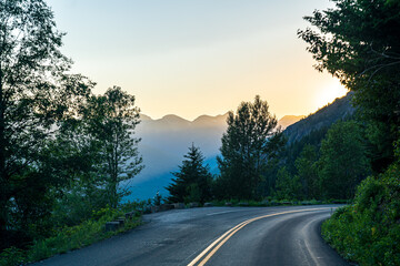 Golden hour, as viewed while driving on the Going to the Sun Road in Glacier National Park in Montana on a beautiful sunny summer evening