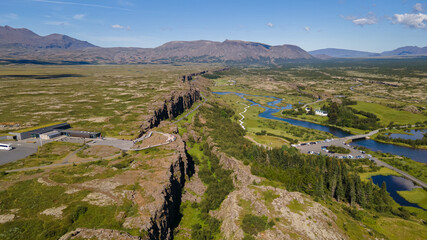 Fototapeta na wymiar View of Thingvellir national park, Iceland's parliament, the Thingvellir Church and the ruins of old stone shelters, hikes and lake