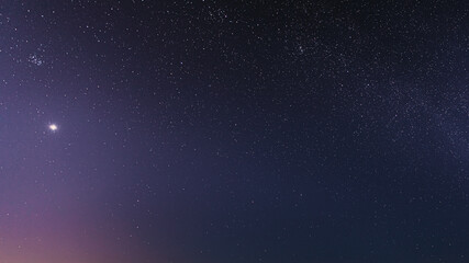 Fototapeta na wymiar Night Starry Sky With Glowing Stars. Bright Glow Of Planet Venus In Sky Among The Stars. Starry Backdrop Background