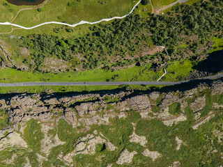 View of Thingvellir national park, Iceland's parliament, the Thingvellir Church and the ruins of old stone shelters, hikes and lake