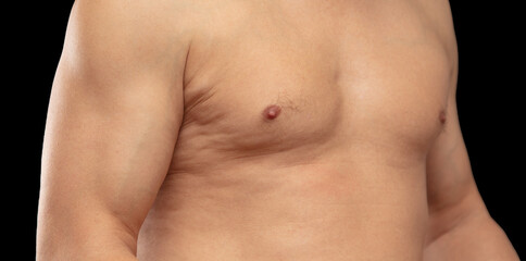 Fototapeta premium Inflated muscles of a man on a black background.