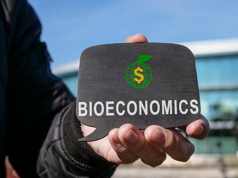A man holds a tablet with word bioeconomy.