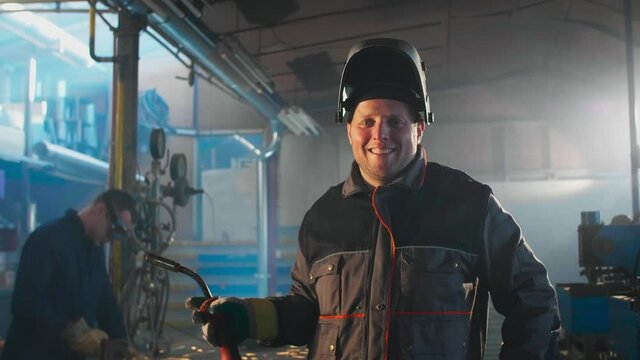 Portrait of a welder posing in a workshop