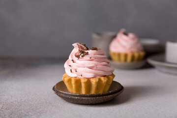 Cupcakes with pink meringues on top. Wedding, valentine's day sweet food concept. Russian cake tartlet. Desserts and sweets