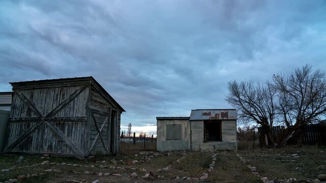Colorful timelapse sunset with old wood shed and chicken coop in Afton Wyoming.