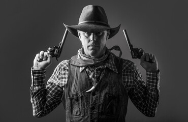 Man wearing cowboy hat, gun. Portrait of a cowboy. West, guns. Portrait of a cowboy. Western man...