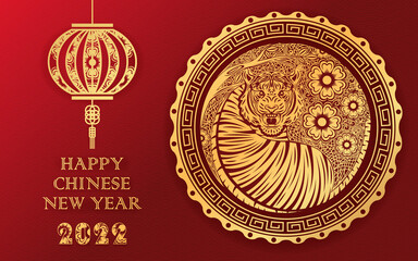 Chinese new year 2022, year of the tiger banner with gold tiger zodiac and gold flower and asian elements paper cut with craft style.