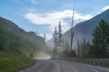 North Fork Road section headed to Bowman Lake and Kintla Lake in Glacier National Park near Polebridge, Montana on a sunny summer day
